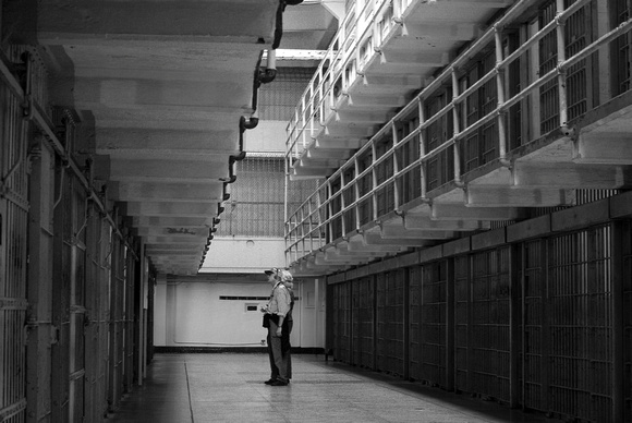 People contemplating Alcatraz's cells